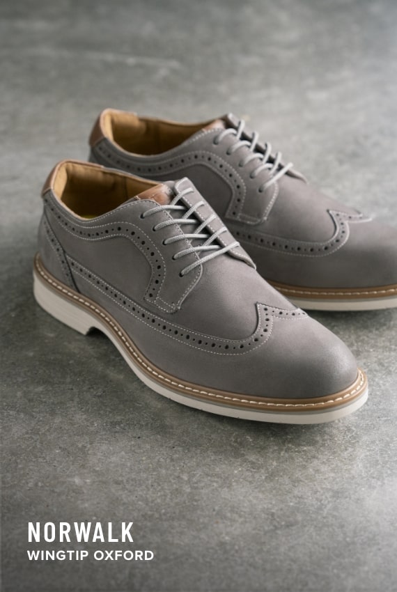 Shoes for Men view all category. Image features the Norwalk Wingtip in grey.