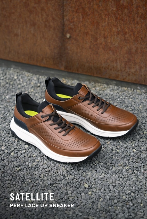 Men's Casual Shoes category. Image features the Satellite Perf in cognac. 