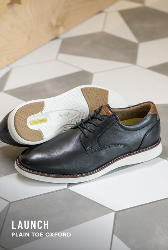 Florsheim Comfortech category. Image features the Launch plain toe oxford in black. 