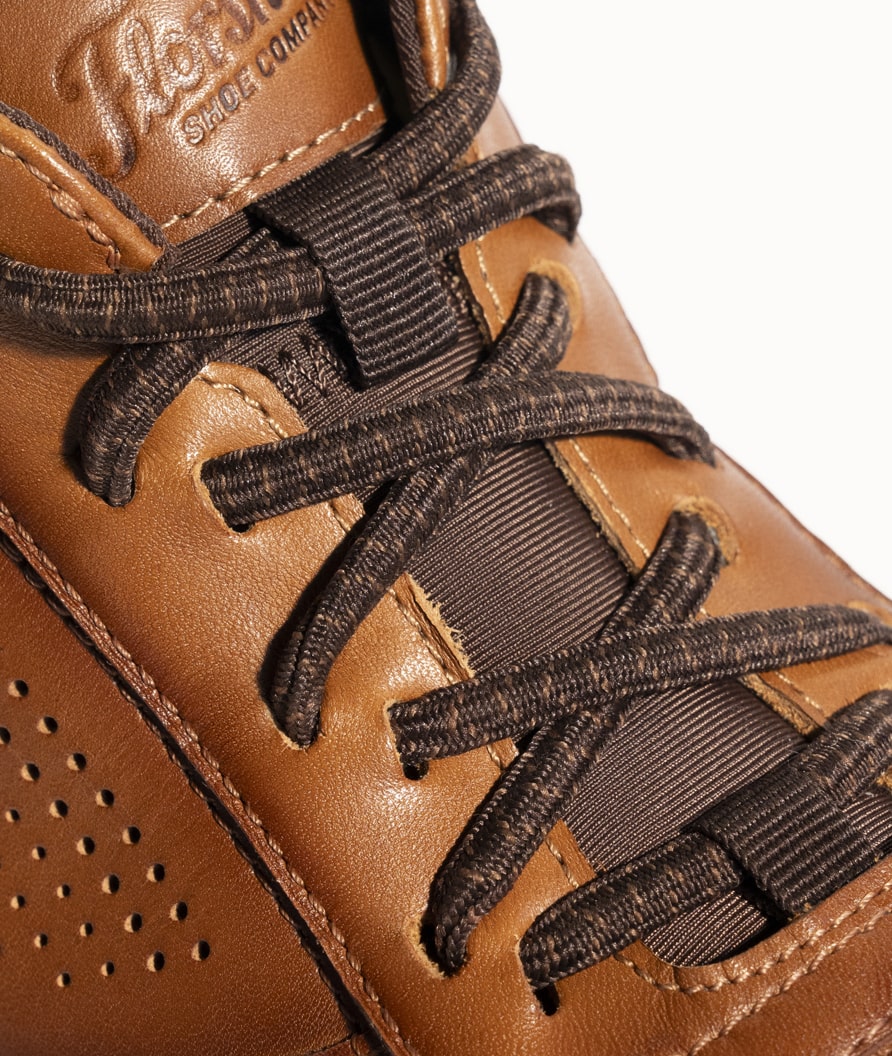 Easily slip shoes on and off with elastic no-tie laces.